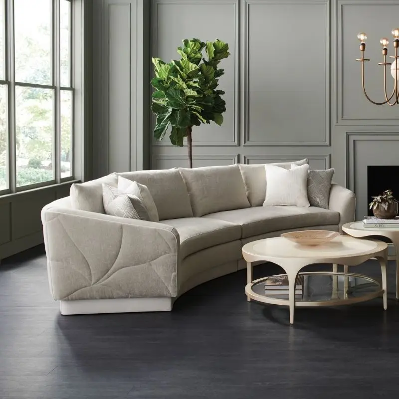CARACOLE UPHOLSTERY FANCIFUL 右扶手雙人布沙發，帶有弧形包覆扶手與立體車縫細節，適合 Contemporary Luxury 客廳空間